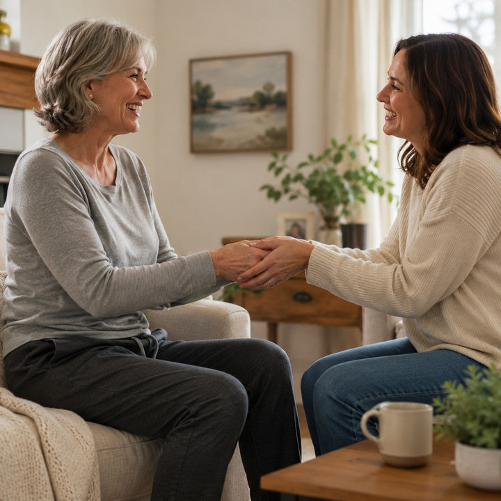 Two people exchanging a gift at home, symbolizing care and support after surgery