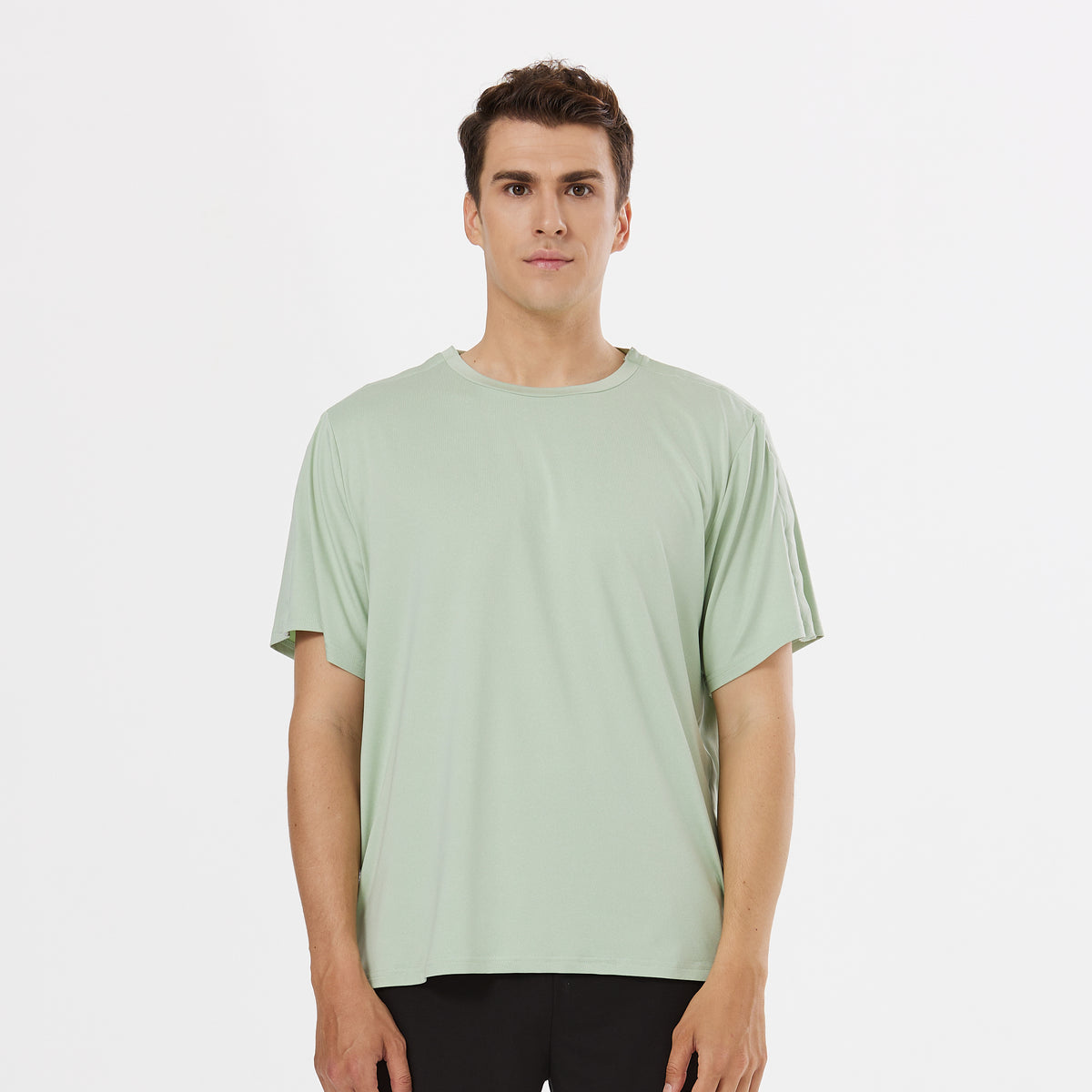 Man wearing a Sage Green side-snap shirt.