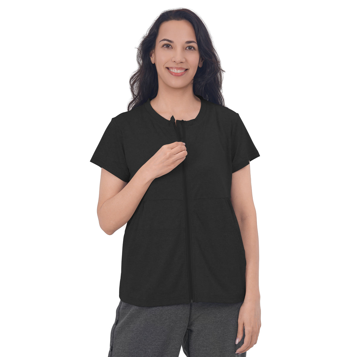 Woman wearing a Black front-zip recovery shirt.