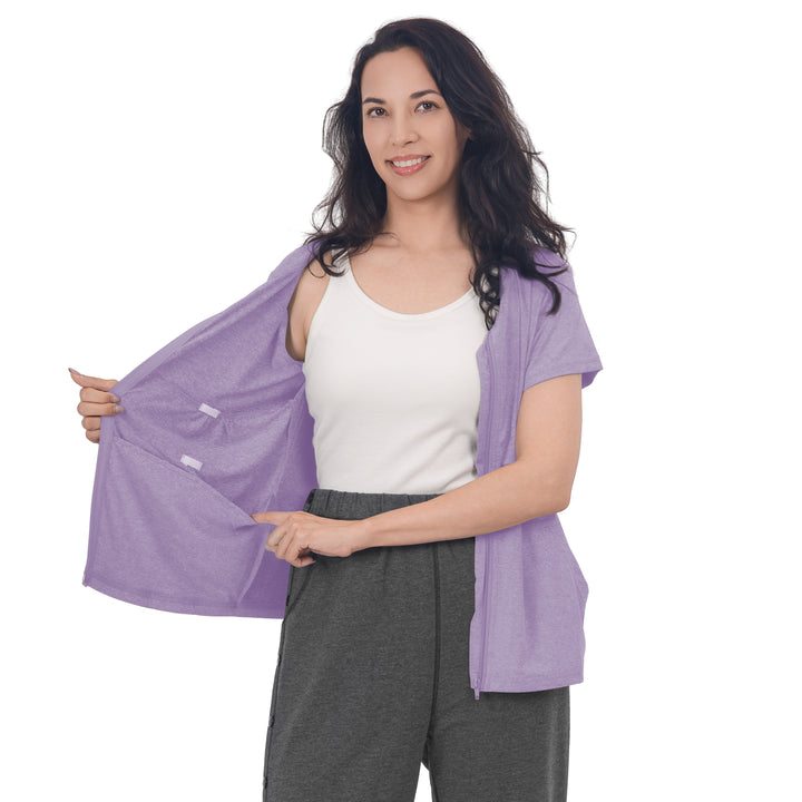 Woman holding a Lavender Mist front-zip shirt open to show the inner pockets. #lavender-mist_group
