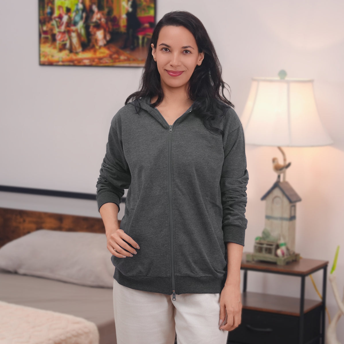 Woman wearing a Gray zip hoodie.