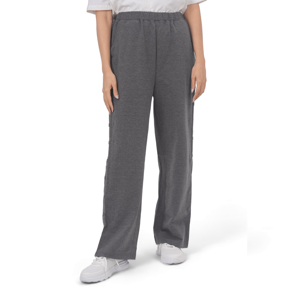 Woman wearing Charcoal Gray recovery pants, front view.