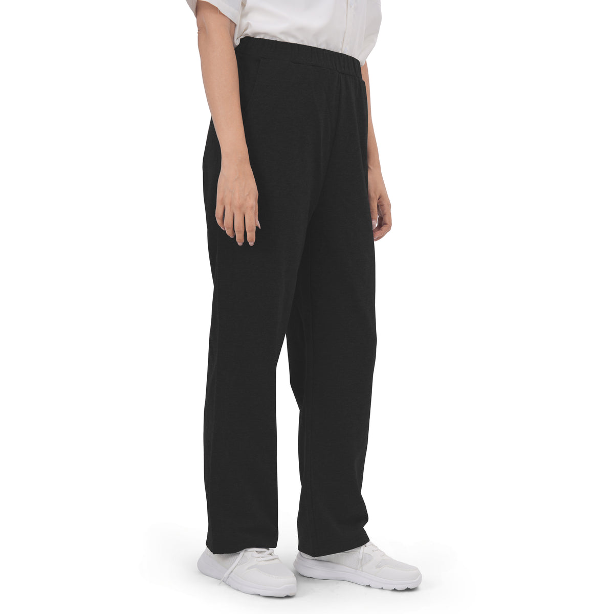 Woman wearing Black recovery pants, three-quarter view.