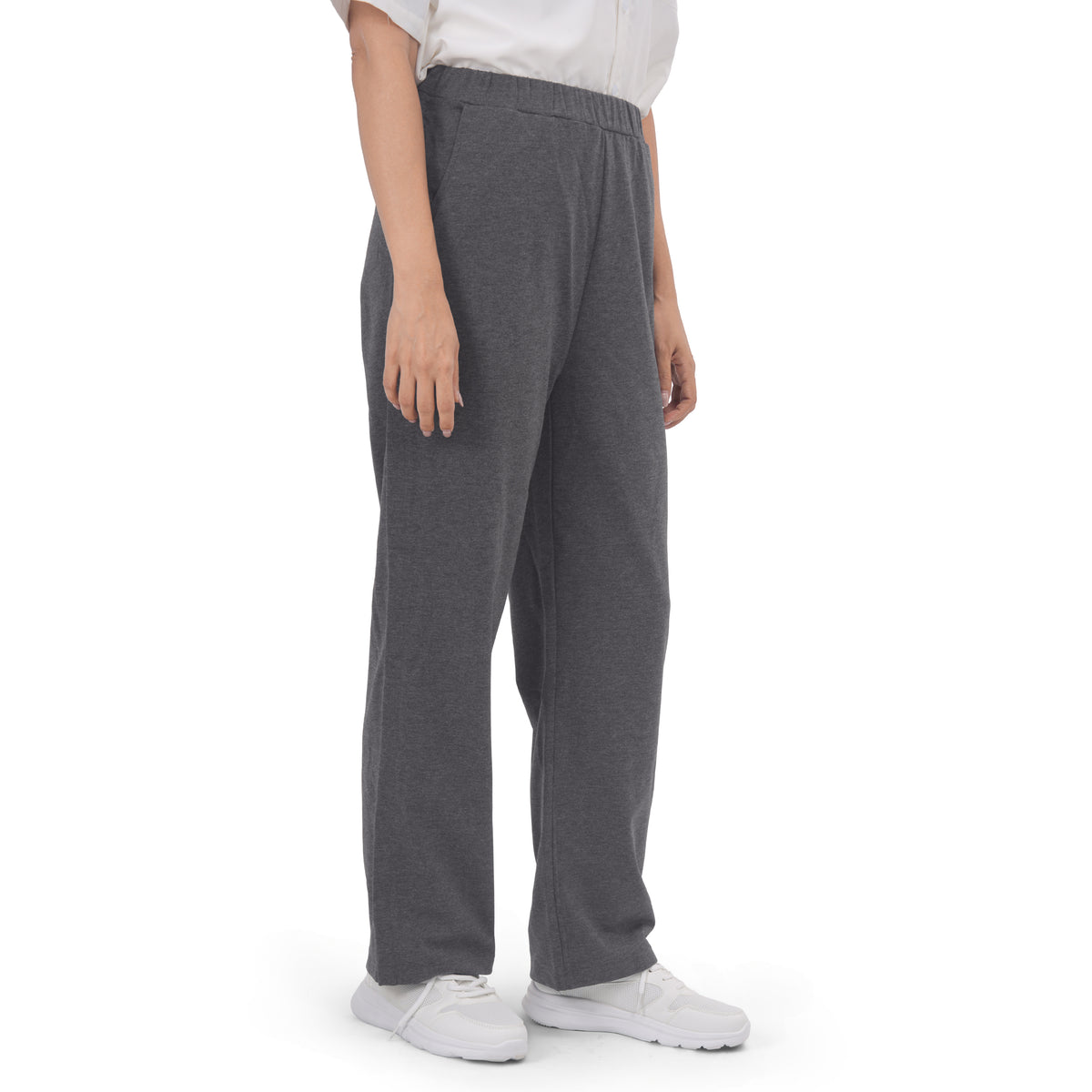 Woman wearing Charcoal Gray recovery pants, three-quarter view.