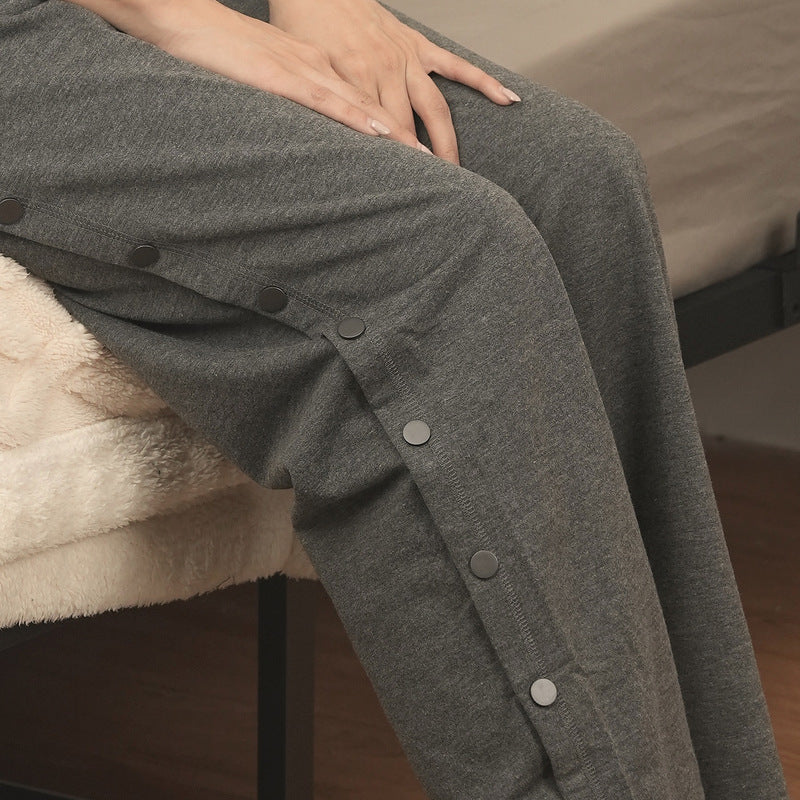 Side snap row on gray recovery pants
