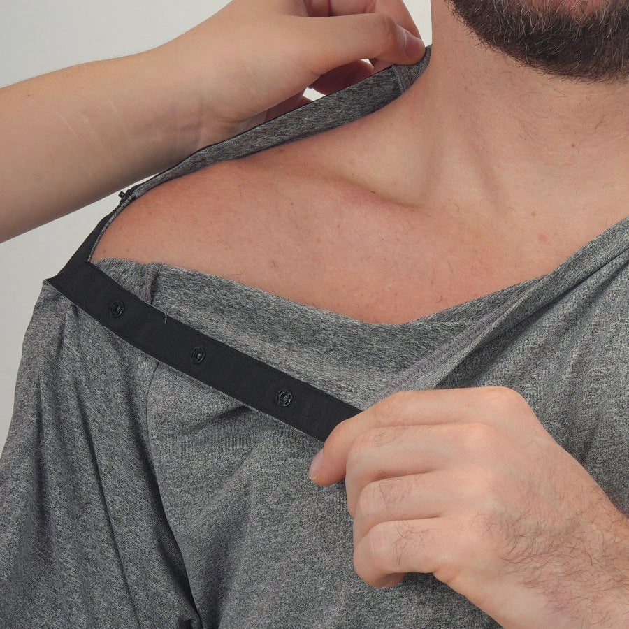 Shoulder-to-side snap opening on a gray recovery shirt
